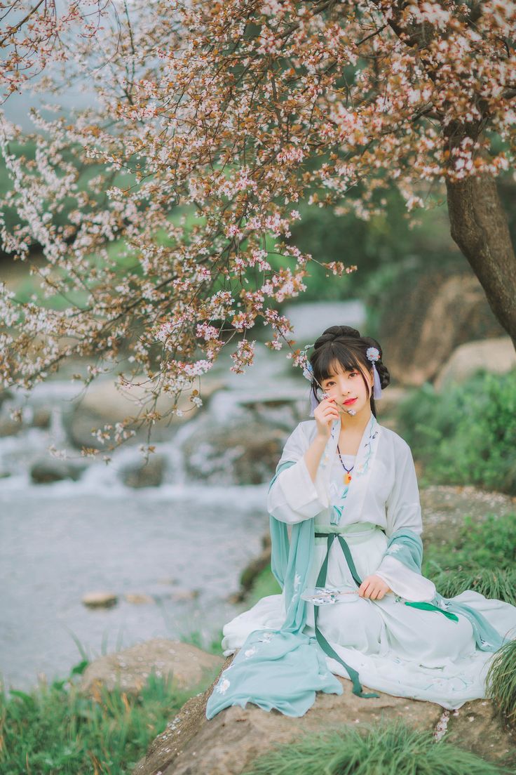 Tree sakura and model with aquamarine hanfu
