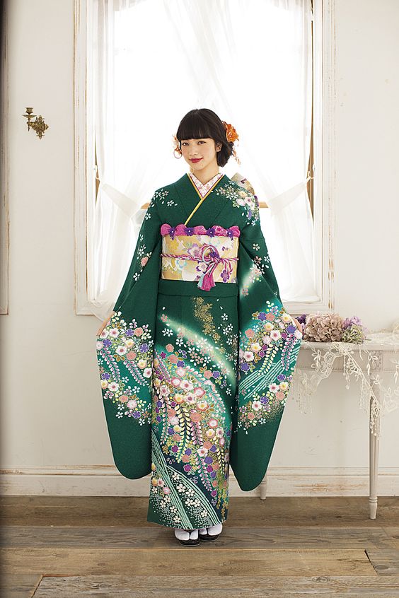 Model with green Kimono in front of the window