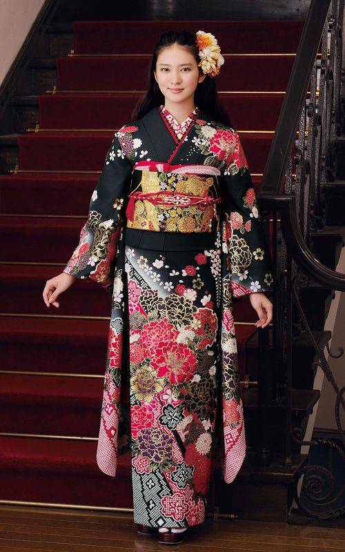 Model with black and red flower Kimono in front of refined staircase